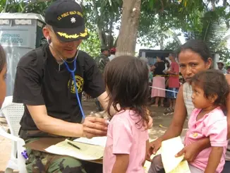 CDR Izune Hwang, a family-practice physician from the Centers for Disease Control and Prevention within the U.S. Department of Health and Human Services, evaluates patients at Escuela El Higueral, in the Republic of Guatemala, as part of Operation Continuing Promise, the deployment of the USS Boxer to the west coast of Central America. The small community, the economy of which revolves around sugar cane, has not had access to a health-care provider in over 10 years.